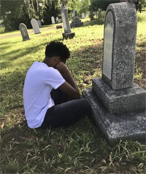 At His Adoptive Mother’s Grave, a Boy Discovers an Envelope with His Name.