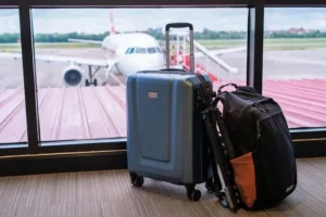 Why should you take a photo of your luggage before checking it in when flying?