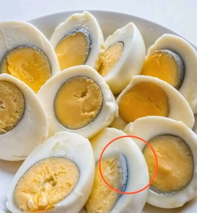 What causes the green ring around hard-boiled eggs?