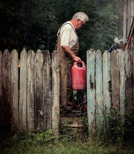 My Husband Said He Was Driving to His Childhood Friend’s Funeral – But Then I Found Him Behind Our Country House, Dousing Something in Gasoline